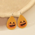 Detail shot of teardrop earrings featuring Halloween pumpkin lanterns on faux leather - Orange-Yellow Pumpkin Style