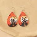 Faux leather teardrop earrings featuring a Halloween castle and bat design in orange - Dark Night Castle Style