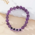 Handmade amethyst beaded bracelet featuring purple natural stones and evil eye charms - Amethyst Style