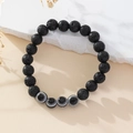 Handmade Evil Eye bracelet with black lava stone beads and natural stone accents - Lava Stone