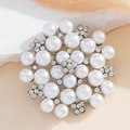 Elegant floral pearl brooch with sparkling rhinestones in a circular cluster design - Pearl White