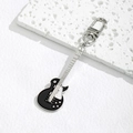 Detailed close-up of a silver metal electric guitar keychain with black enamel details - Black
