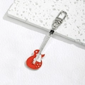Macro view of a red electric guitar keychain featuring metallic enamel finish and a lobster clasp - Red