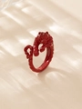 Macro shot of a red glazed metal tiger ring with soft natural window shadows - Full Tiger Wrap (Style 4 Red)