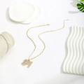 Golden necklace with a crystal-encrusted number 94 pendant on a white background - Pave White Rhinestone Style / Gold