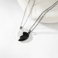 Detailed close-up of magnetic heart pendants with crown relief on textured background - Style 1 (Crown Relief)