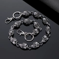 Detail of gothic skull metal trouser chain with lobster clasp on black background - Black Skull