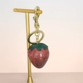 Sparkly red strawberry keychain with green leaves and gold hardware for bags - Pink Strawberry