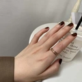 Close-up of rose gold textured ring with starry finish worn on a finger with dark nails - US 5 / Inlaid Frosted Rose Gold