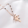 Close-up of rose gold Tree of Life pendant necklace with sparkling crystal accents - Money Tree Shape / Rose Gold