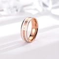 Detail of rose gold ring with white inlay and 'BE THE CHANGE' engraved text - US 4 / Rose Gold & White