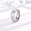 Macro detail of stainless steel ring featuring white enamel inlay and Be The Change engraving - US 4 / Silver Tone & White