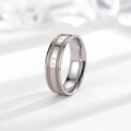 Detailed close-up of Be The Change engraving on a tricolor stainless steel ring - Silver Tone & Grey