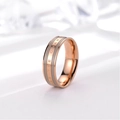 Detailed macro view of 18k rose gold ring with grey enamel and BE THE CHANGE engraving - Rose Gold & Grey