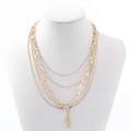 Detail view of gold layered necklace with paperclip chain and hexagon rhinestone pendant - Four Layer Hexagon Rhinestone Style (NXN01975) / Gold