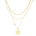 Gold layered necklace featuring a Cancer zodiac coin pendant and sparkling round zircon - Cancer