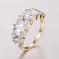 Golden ring with sparkling princess-cut cubic zirconia in a continuous row setting - 16 / Real Gold