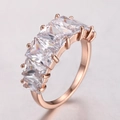 Exaggerated rose gold ring with five rectangular cubic zirconia stones in a row - 16 / Rose Gold