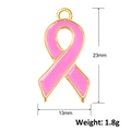 Detailed macro view of a 23mm pink enamel ribbon charm with gold-plated metal edges - Classic Ribbon Style (A0918)