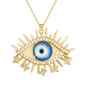 Gold Evil Eye necklace with blue zircon pendant and hanging star charms on white background - Blue White Black Eye Style (SL458)