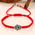 Rode gevlochten Hamsa hand armband met blauwe Evil Eye hanger en verstelbaar koord - Rood Touw Hamsa