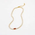 Gold-plated tennis chain necklace with white cubic zirconia and a red rectangular center gem - Necklace / Purple