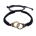Detail view of black braided bracelet featuring bronze freedom handcuffs and adjustable knot - Handcuff Style (D0002) / Bronze