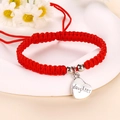 Close-up of red braided rope bracelet with a heart pendant engraved with daughter - Daughter Silver (J1373)