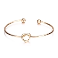 Minimalistische gouden open armband met hartknoop ontwerp voor dames - Legering Goud (D0011)