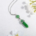 Detail of a silver-tone necklace featuring a green hexagonal prism crystal pendant - Green (N0278)
