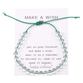 Dettaglio del bracciale dei desideri intrecciato verde regolabile con perline e cuore - Verde