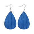 Detailed close-up of blue teardrop leather earrings with textured wave pattern - Blue