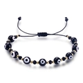 Detail of adjustable evil eye beaded bracelet with black crystals and gold spacers - Black Woven Style (B2742)