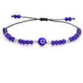 Detail of beaded evil eye bracelet with blue crystal beads and black braided cord - Gold Bead Royal Blue Eye (B2120)