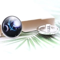 Detail of 20mm zodiac snap button with nebula pattern on palm leaf background - Diameter 20MM / Libra Style (P0975)