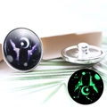 Detail of 20mm Gemini zodiac button showing luminous green glow in dark background - Diameter 20MM / Luminous Gemini Style (P0982)