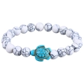 Detailed macro view of a white marble bead bracelet featuring a turquoise sea turtle charm - White Turquoise Turtle (B3556)
