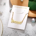Macro shot of Scorpio constellation gold necklace with stainless steel jewelry detail - Scorpio-Gold