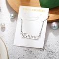 Macro detail of stainless steel Taurus zodiac pendant with polished link chain necklace - Taurus-Silver