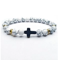 White turquoise beaded bracelet with golden spacers and a black cross pendant - White Turquoise Gold Spacer (J2473)