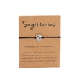 Handmade Sagittarius black braided rope bracelet with silver zodiac pendant on card - Silver Sagittarius (B0779)