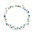 Bracciale di perle malocchio bianco con ciondoli in resina e distanziatori dorati - Tono Oro - Occhio in Vetro a Lume Bianco (B2774)