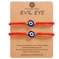 Detail of red woven Evil Eye bracelets set on a branded card for couples protection - 2 Pack (With Display Card) / Red Evil Eye with Gold Beads (B3184)