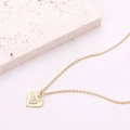 Golden heart necklace featuring a sunburst textured pendant and micro-set zircon accents - Style 13 (N1057)