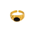 Detail of vintage gold open ring featuring a black oval gemstone and spiral texture - US 7 / Black