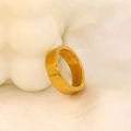Detail showing high-polished golden stainless steel wide band ring on minimalist background - US 7 / Wide Style Gold