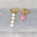 Detail of asymmetrical gold earrings featuring white pearls and a pink pear-cut zircon stone - Pink
