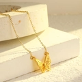 Elegant gold butterfly necklace in brushed titanium steel with fine textured wings - Brushed Butterfly Style / Gold