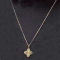 Detailed close-up of a golden laser-cut flower pendant necklace with radial texture - Single Flower Gold