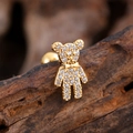Macro view of gold-plated bear stud earring with micro-pave zircons and bow detail - Full Zirconia Bear with Bow Style (3131) / Gold